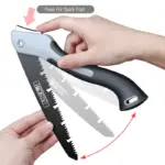 Hands demonstrating how to fold a black and silver folding saw.