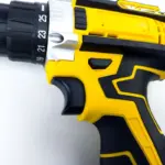 Close-up of a yellow and black power drill.