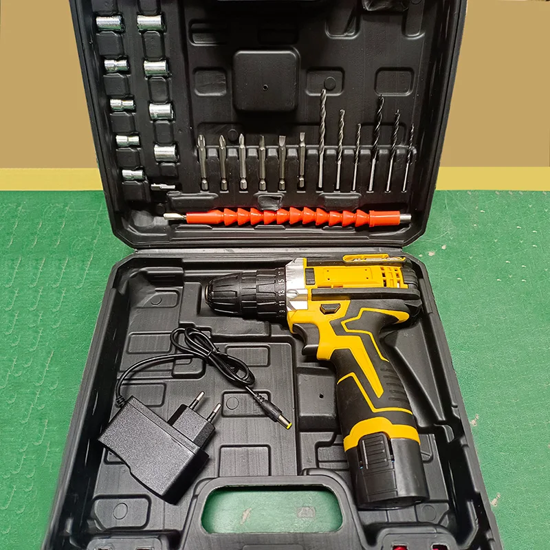 Cordless drill set with accessories in a black case.