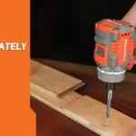 16V cordless drill tightening a screw on wooden planks.