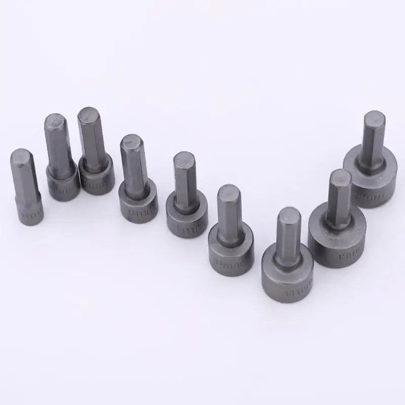 Set of nine hex socket bits arranged in a row.